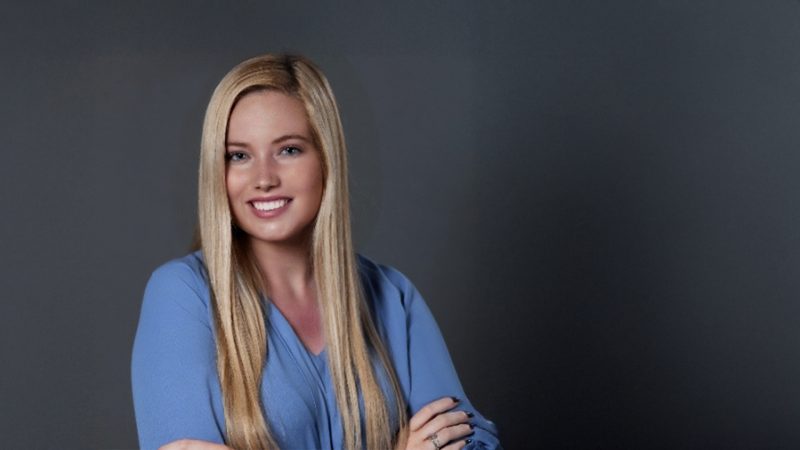 Alexandra Egan standing in front of a grey background